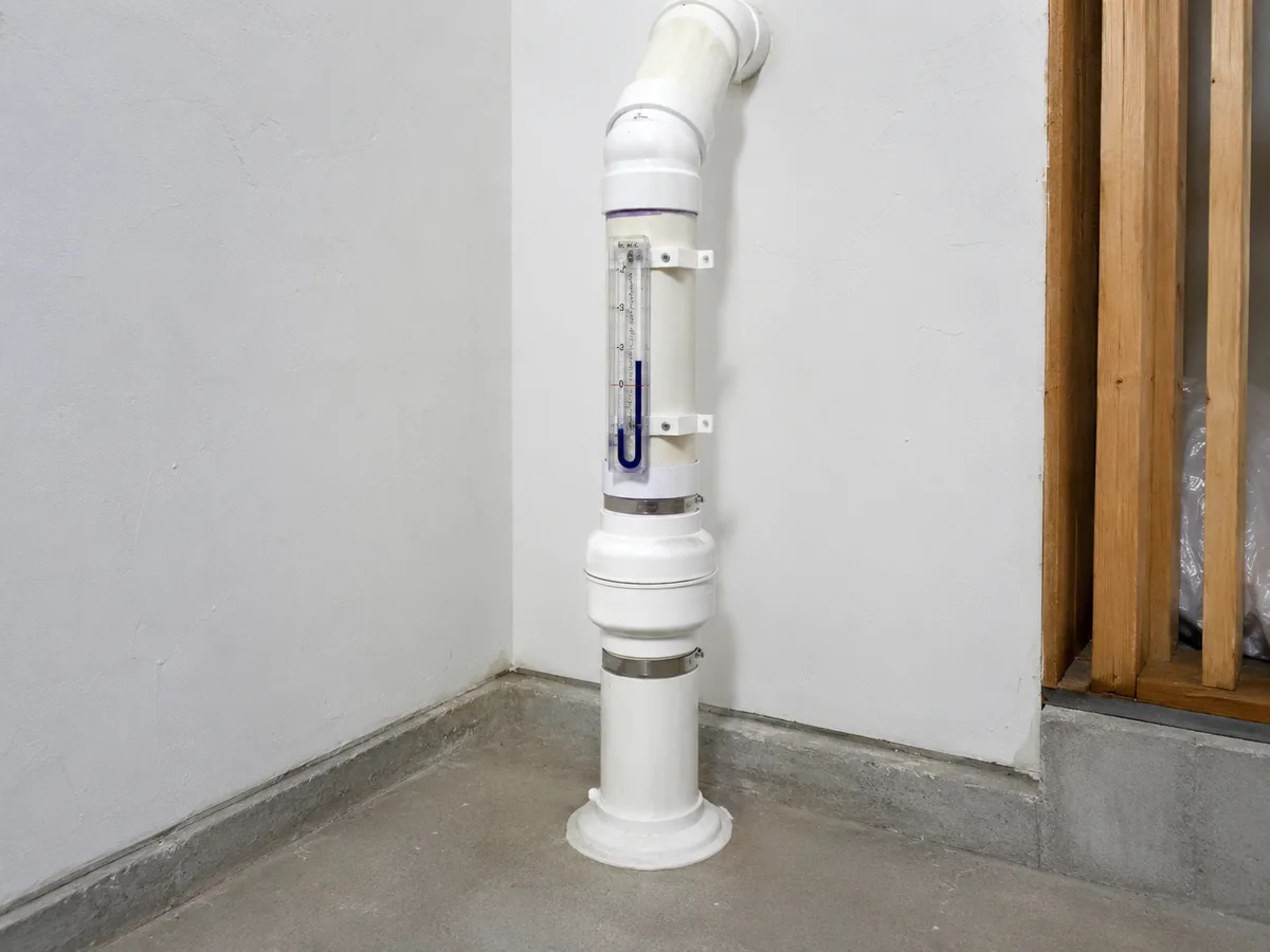 Radon system pressure indicator and piping